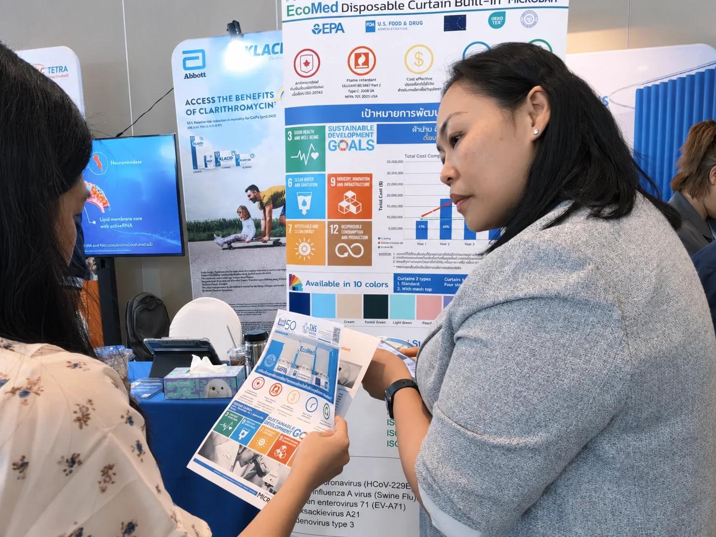 Team member presenting product information to a visitor