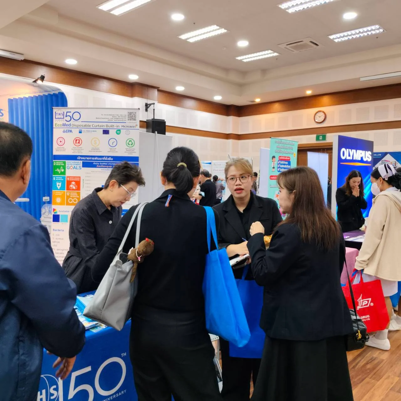 Visitors exploring the booth