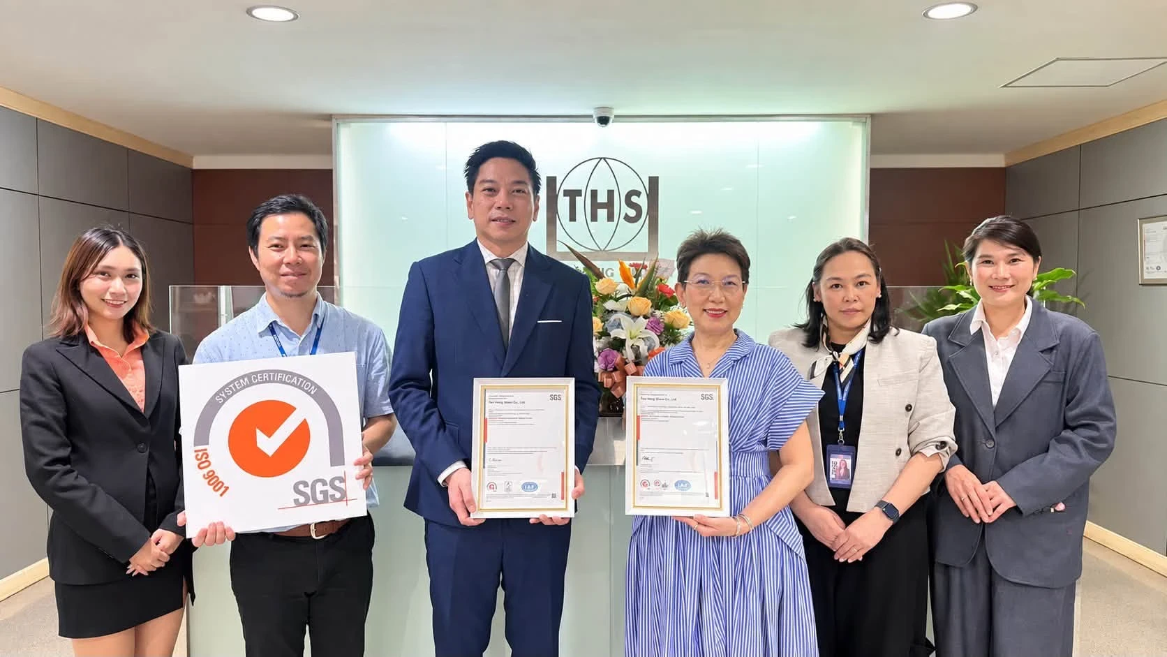 Teo Hong Silom team receiving the ISO 9001 certificate from SGS